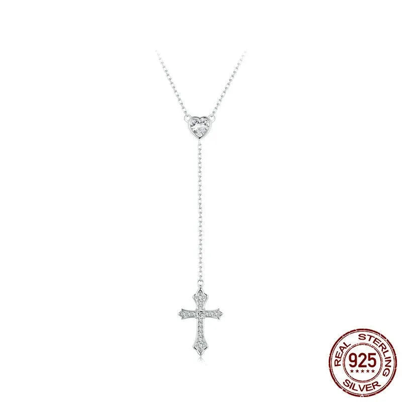 Close-up of a sterling silver V-neck love cross pendant on an O-ring chain.