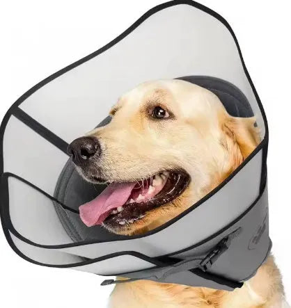 Soft, adjustable polyester recovery collar ring for dogs and cats post-surgery, shown in beige on a table.