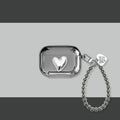 Electroplated solid colour iPhone headphone case with heart pendant attachment on a soft TPU shell.