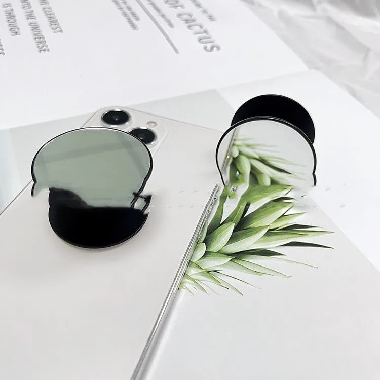 Universal airbag phone bracket in black, 4cm diameter, 6mm thick, with 23mm telescopic stretch.