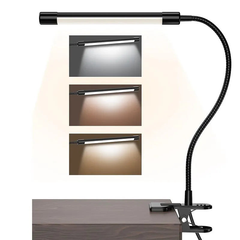 Black and white USB-powered LED desk lamp with a 26 cm long base on a wooden desk.