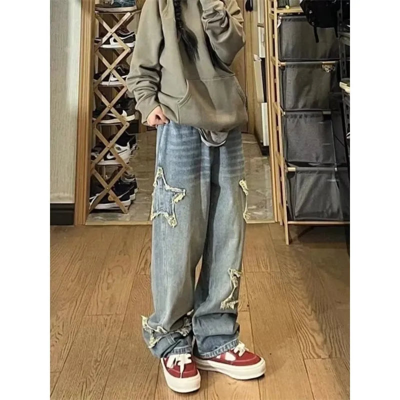 Blue high-waisted women's wide-leg denim jeans with straight-leg cut on a neutral background