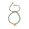 Red rope hand woven women's bracelet with floral elements in national style