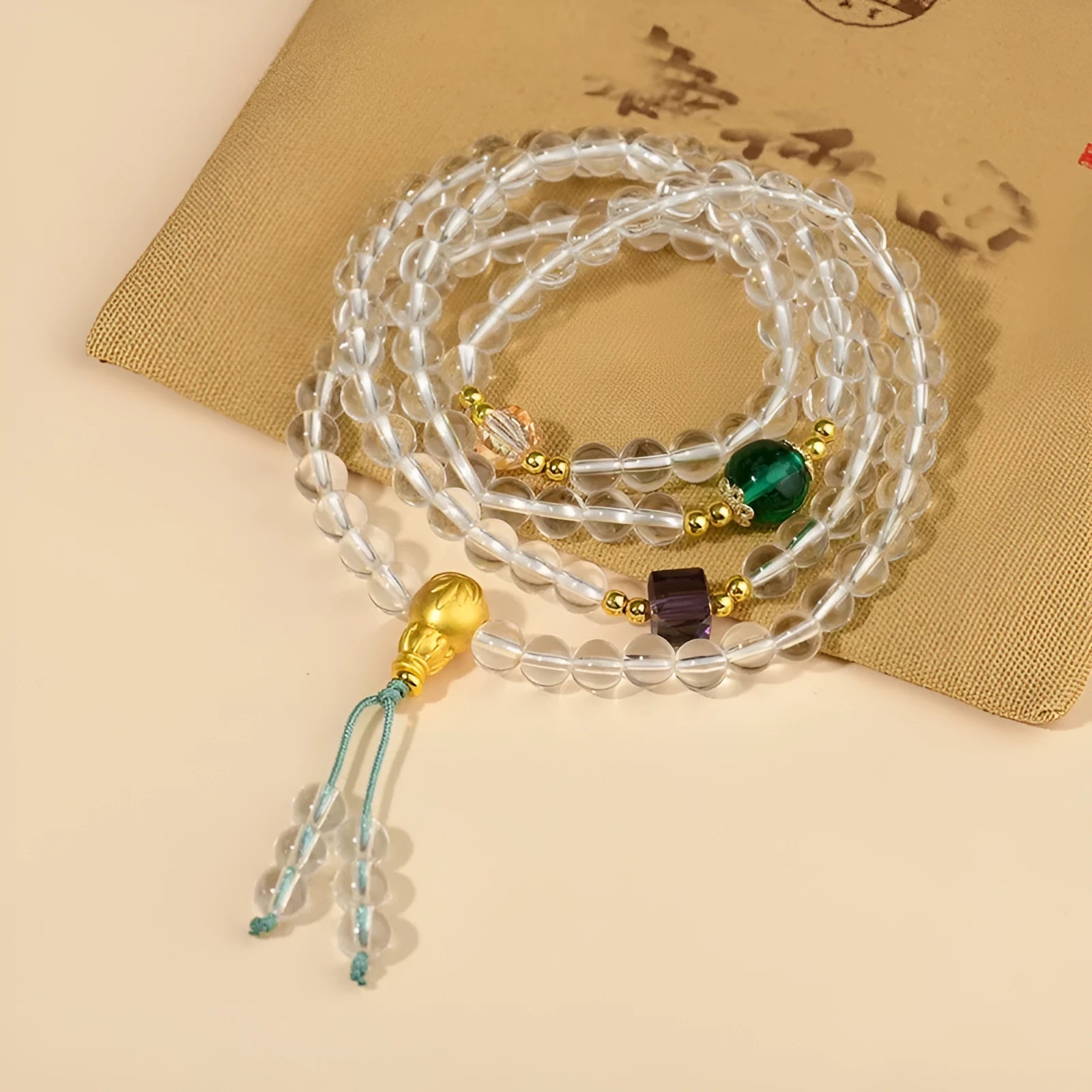 White crystal 108 bead rosary bracelet with geometric ethnic design