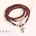 Women's crystal bracelet with wine red garnet colour and flower shape, featuring Bohemian and ethnic design elements.