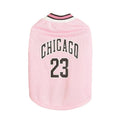 Mesh polyester dog basketball vest in black with basketball design, side view on a white background