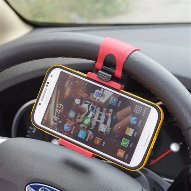 Black universal steering wheel phone mount clip holding a smartphone for hands-free use while driving.