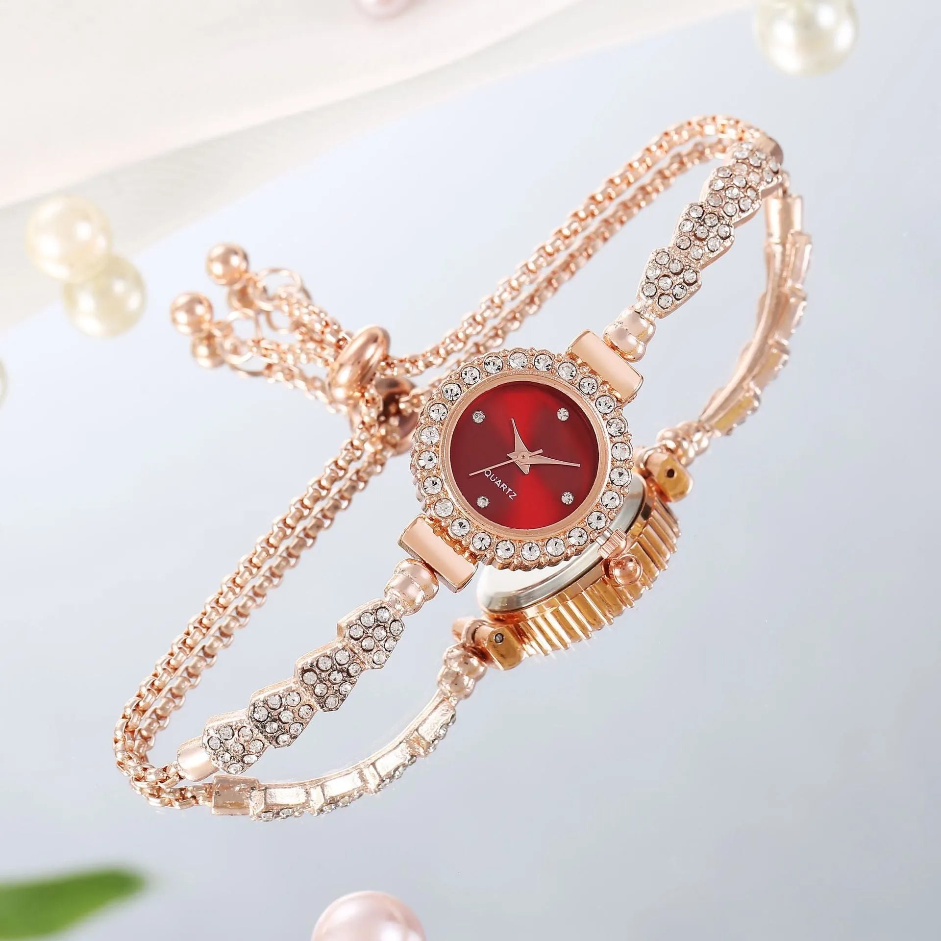 Gold fine strap women's watch with round dial and stainless steel jewellery buckle