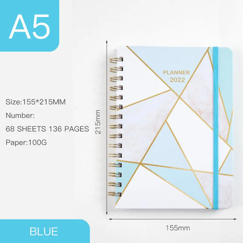 A5 spiral notebook with colourful floral cover, open to show lined pages and metal coil binding