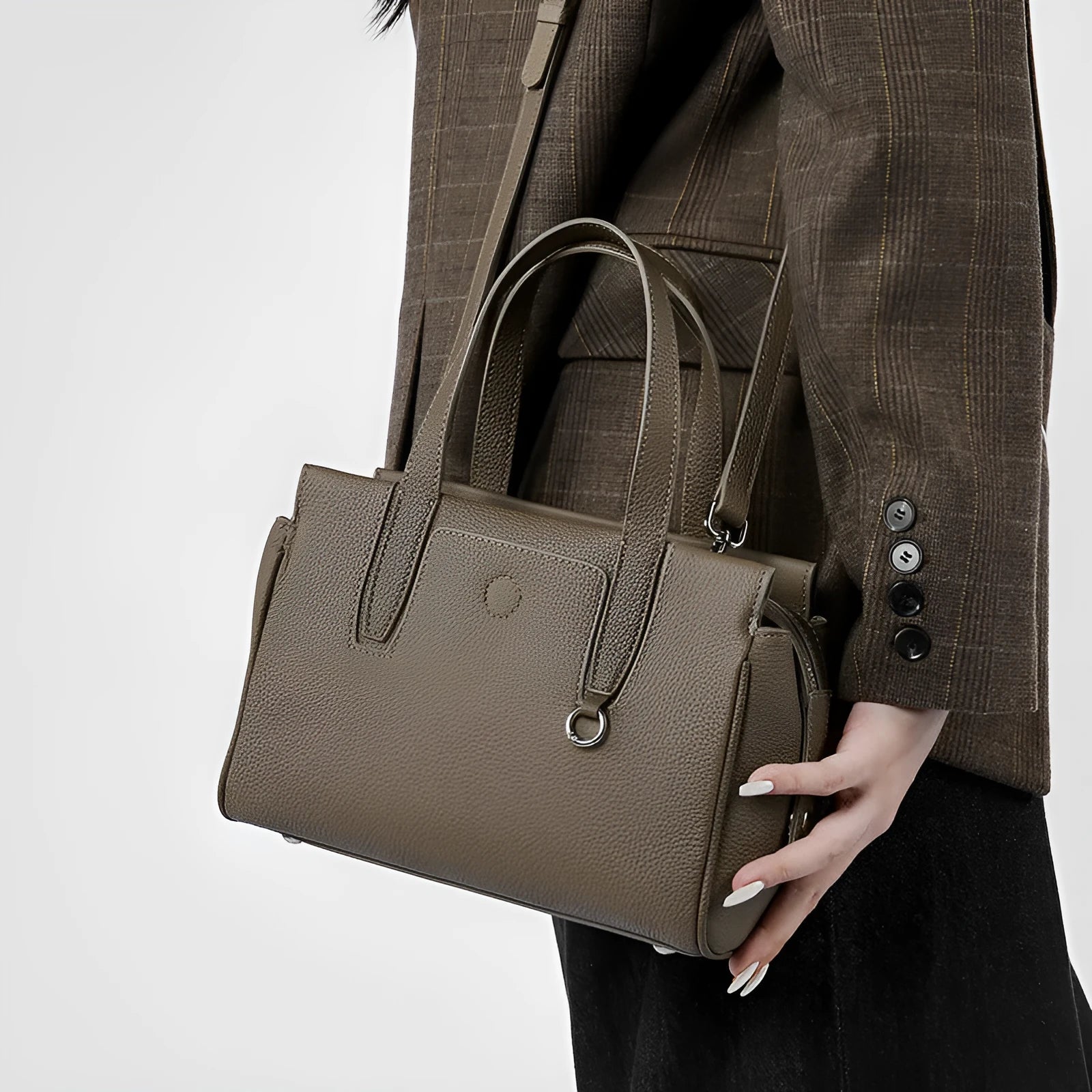 Genuine leather crossbody bag in horizontal square design with single strap, shown in black colour option.