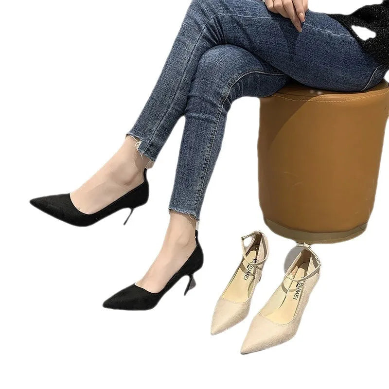 Women's black and creamy white stiletto heel shoes with buckle detail for graduation photos