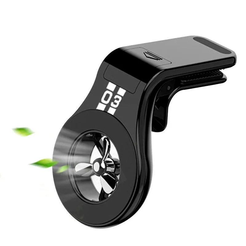Black magnetic car phone holder mounted on a car air vent, showing 360-degree rotation and fragrance slot.
