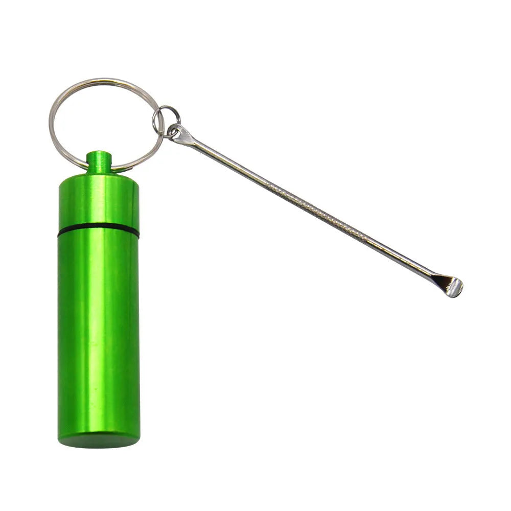 Blue aluminium portable pill storage bottle with an integrated spoon and a silver keychain ring attached.
