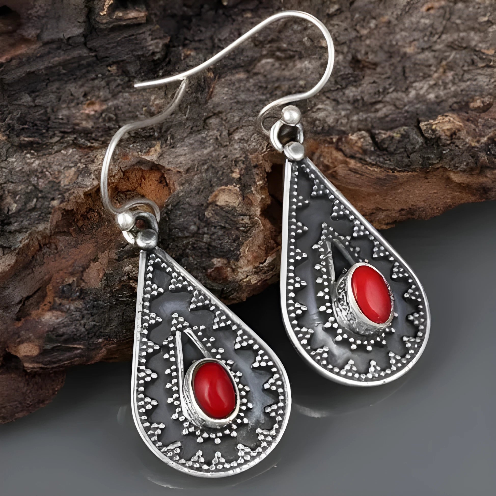 Silver drop earrings with a red pine gemstone in a retro zinc alloy setting.