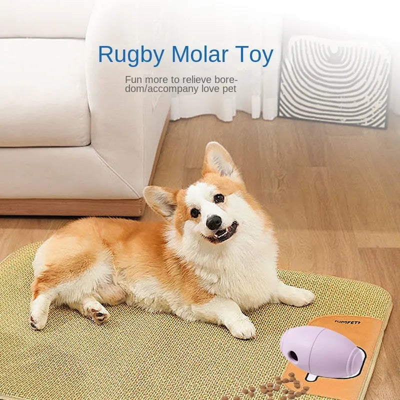 Blue silicone rugby ball dog toy with treat-dispensing centre for chewing and fetching