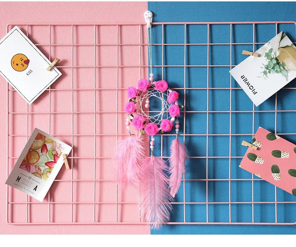 Pink ostrich feather dreamcatcher wall decoration ornament measuring 10cm.