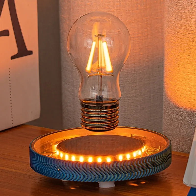 A small, 3D-printed moon night light hanging in mid-air via magnetic suspension.