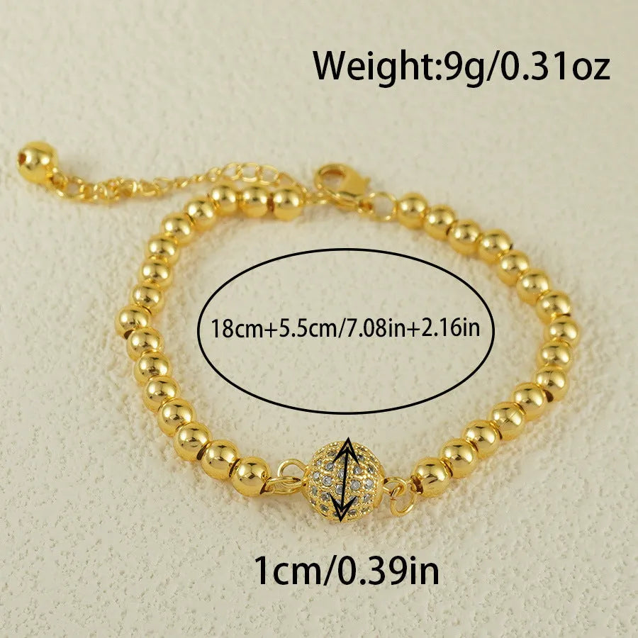 Close-up of a women's heart-shaped copper bracelet with a single round zircon stone, Arabic style.