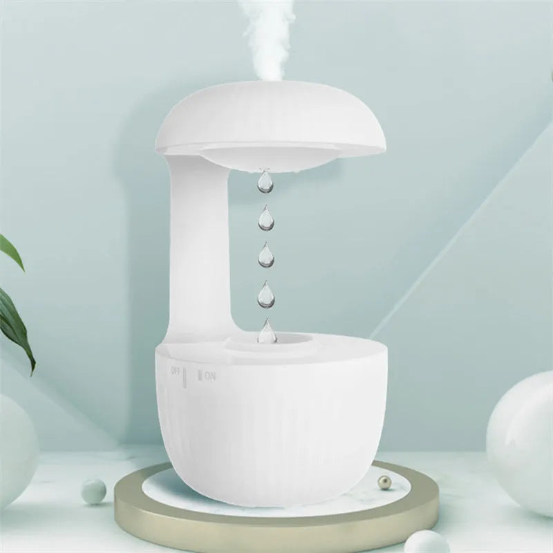 White anti-gravity USB humidifier showing water droplets appearing to flow upward with cool mist output