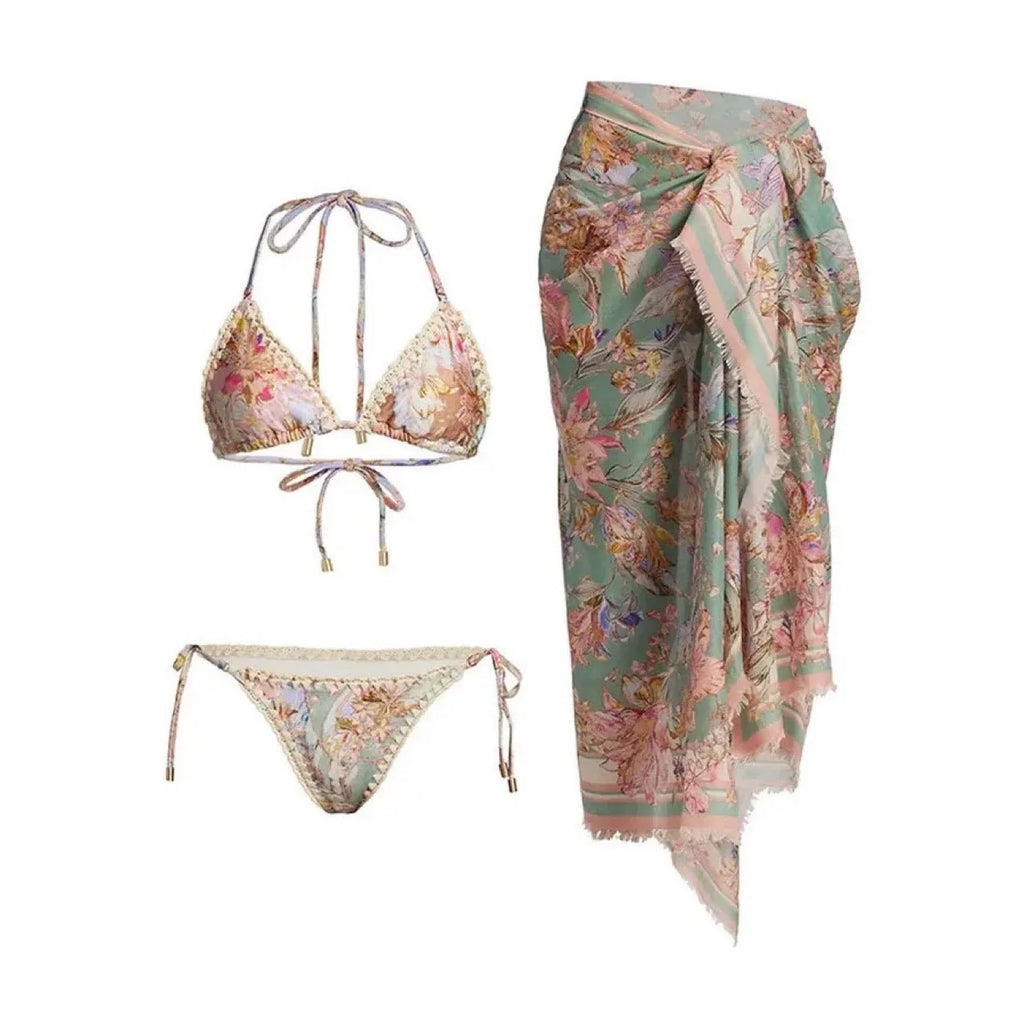 Women's creamy-white floral bikini swimsuit with separate top, underwear, and skirt pieces
