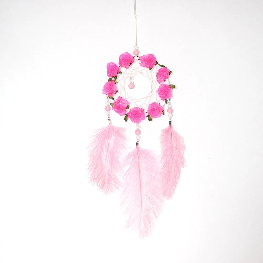Pink ostrich feather dreamcatcher wall decoration ornament measuring 10cm.