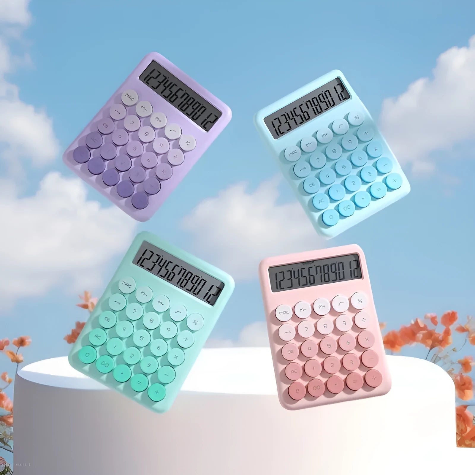 Gradient colour desktop calculator in violet, pink, blue, or green on a desk.