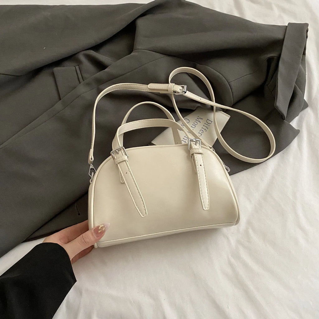 Women's square shoulder bag in PU leather with soft shell shape and optional ribbon pendant