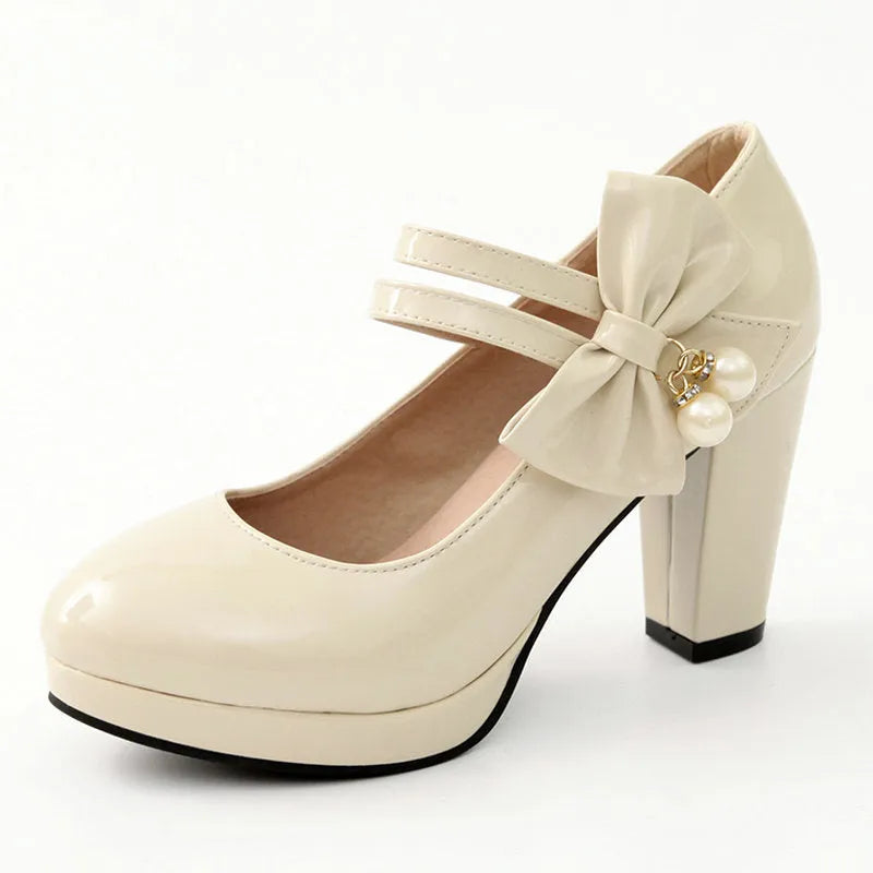 Red platform shoes with chunky heels, round toes, and buckle fastening on waterproof rubber soles