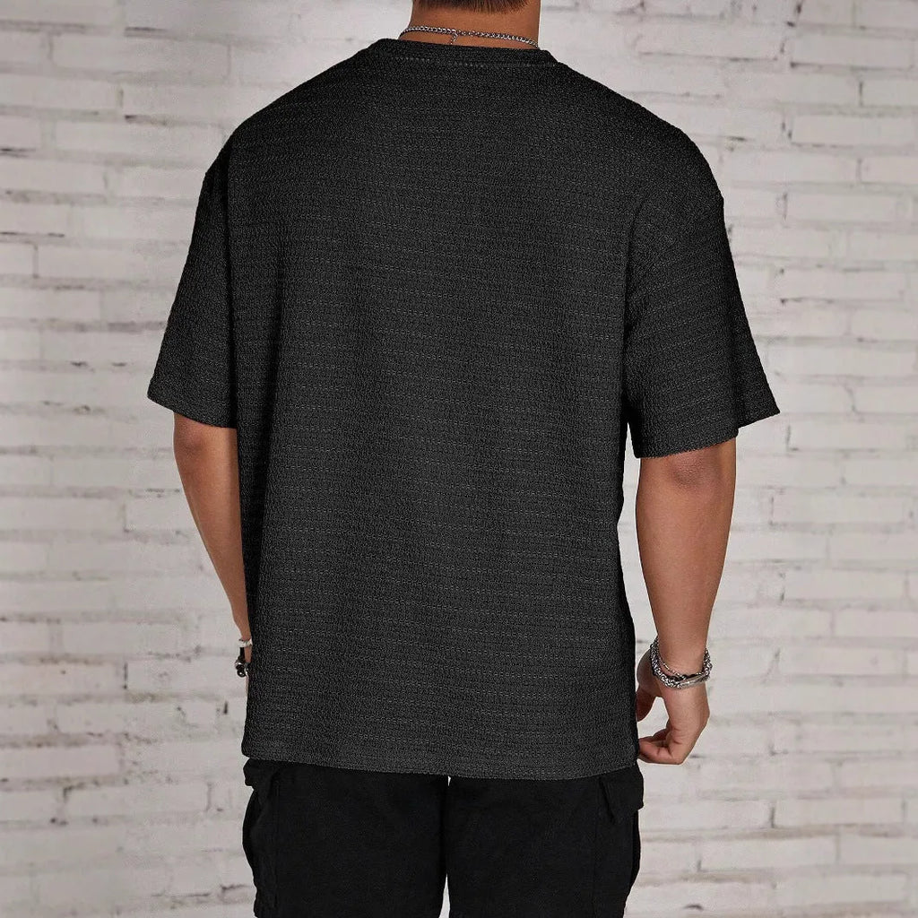 Men's slim fit solid colour short sleeve t-shirt on a hanger.