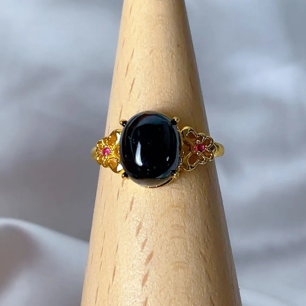 Copper open ring with crystal inlay, geometric shape, black tourmaline colour, on white background