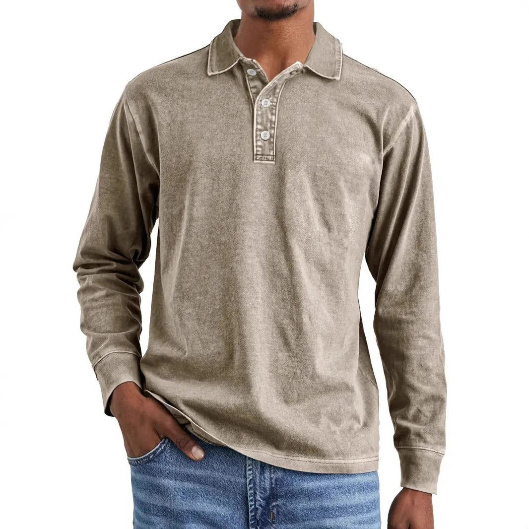 Retro washed long sleeve polo shirt in Army Green on a hanger.