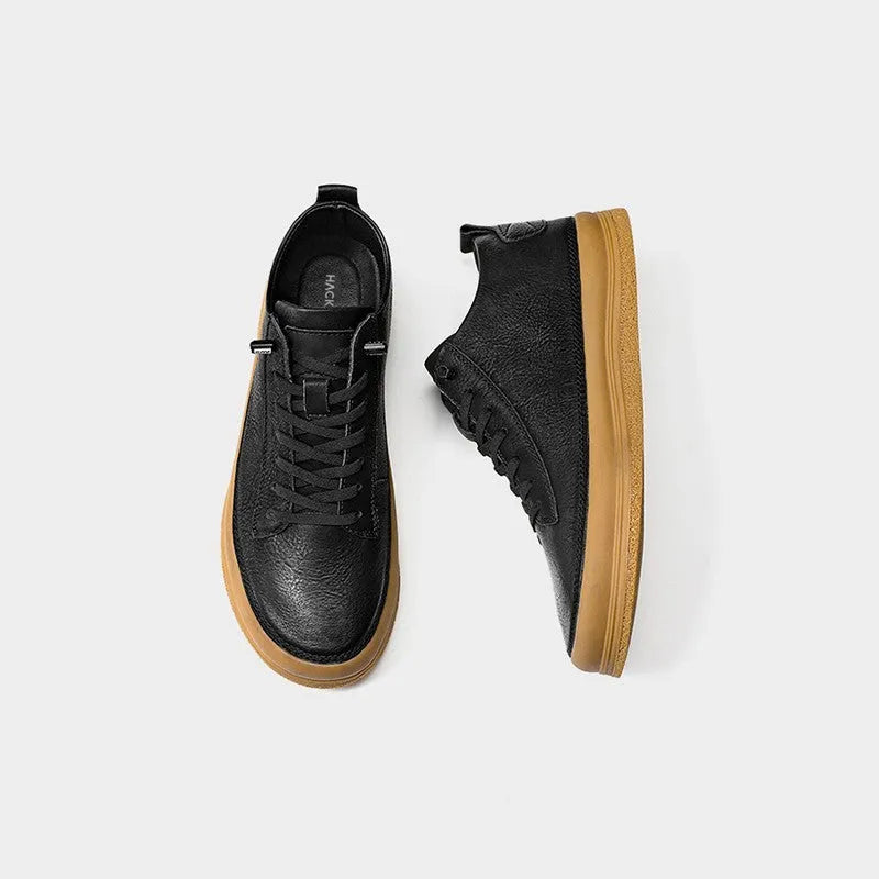 Men's black casual leather shoes with a round toe, lace-up front, and flat rubber sole.