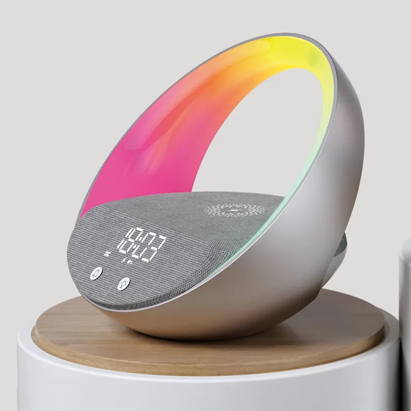 Beige multifunctional wireless charging Bluetooth speaker with clock and adjustable LED mood lighting on a wooden table.