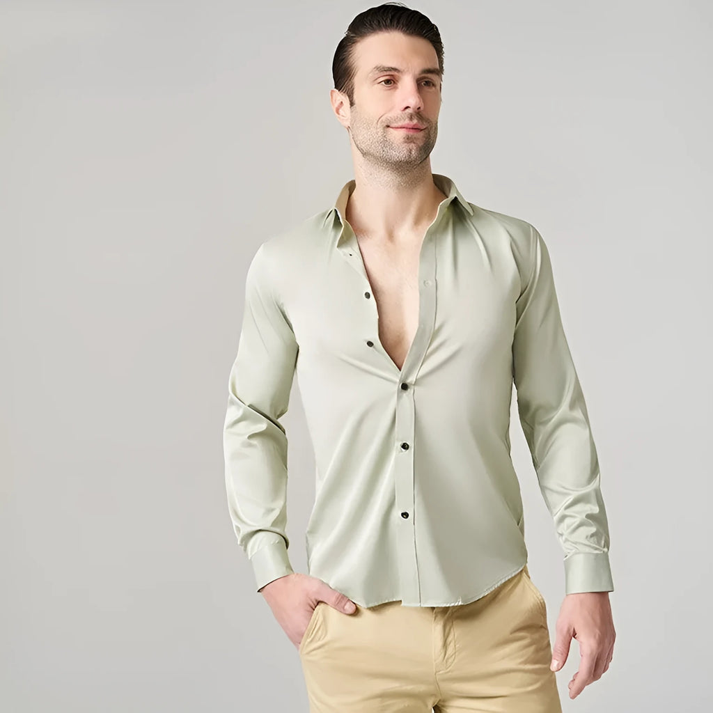 Men's stretch long sleeve work shirt in a blue colour variant on a hanger.