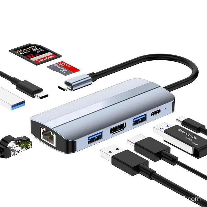 Silver aluminium USB-C 7-in-1 expansion dock with HDMI, USB ports, SD slots, and a 15cm cable.
