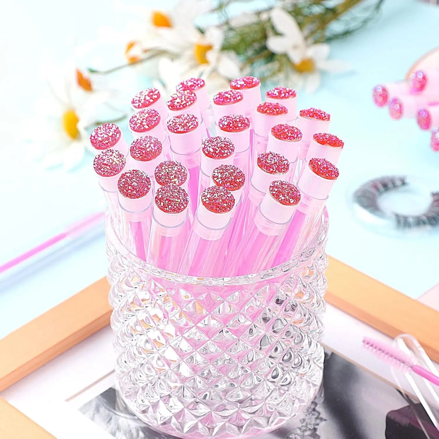 Disposable eyelash spoolie brushes in coloured plastic tubes for mascara and extension cleaning