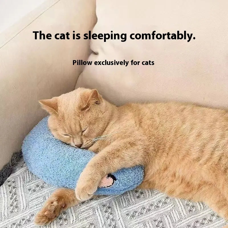 Blue U-shaped cloth pillow for cats on a wooden floor, showing its head-cradling design.