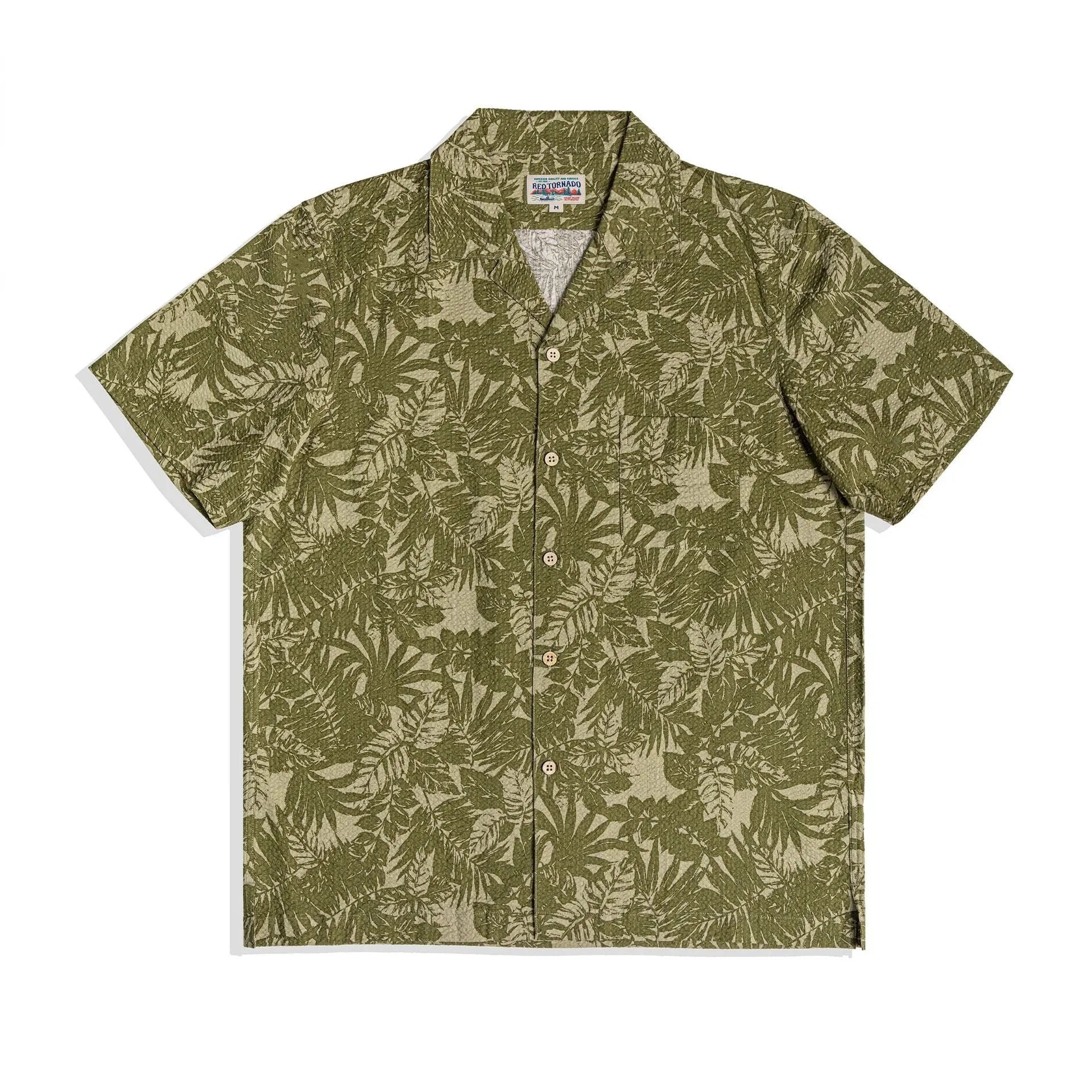 Man wearing a vintage floral print seersucker shirt with a Cuban collar in a loose, casual fit.