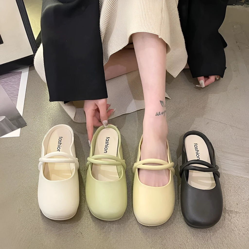 Women's black closed-toe plastic flip flops on a plain background, showing baotou style and strap design.