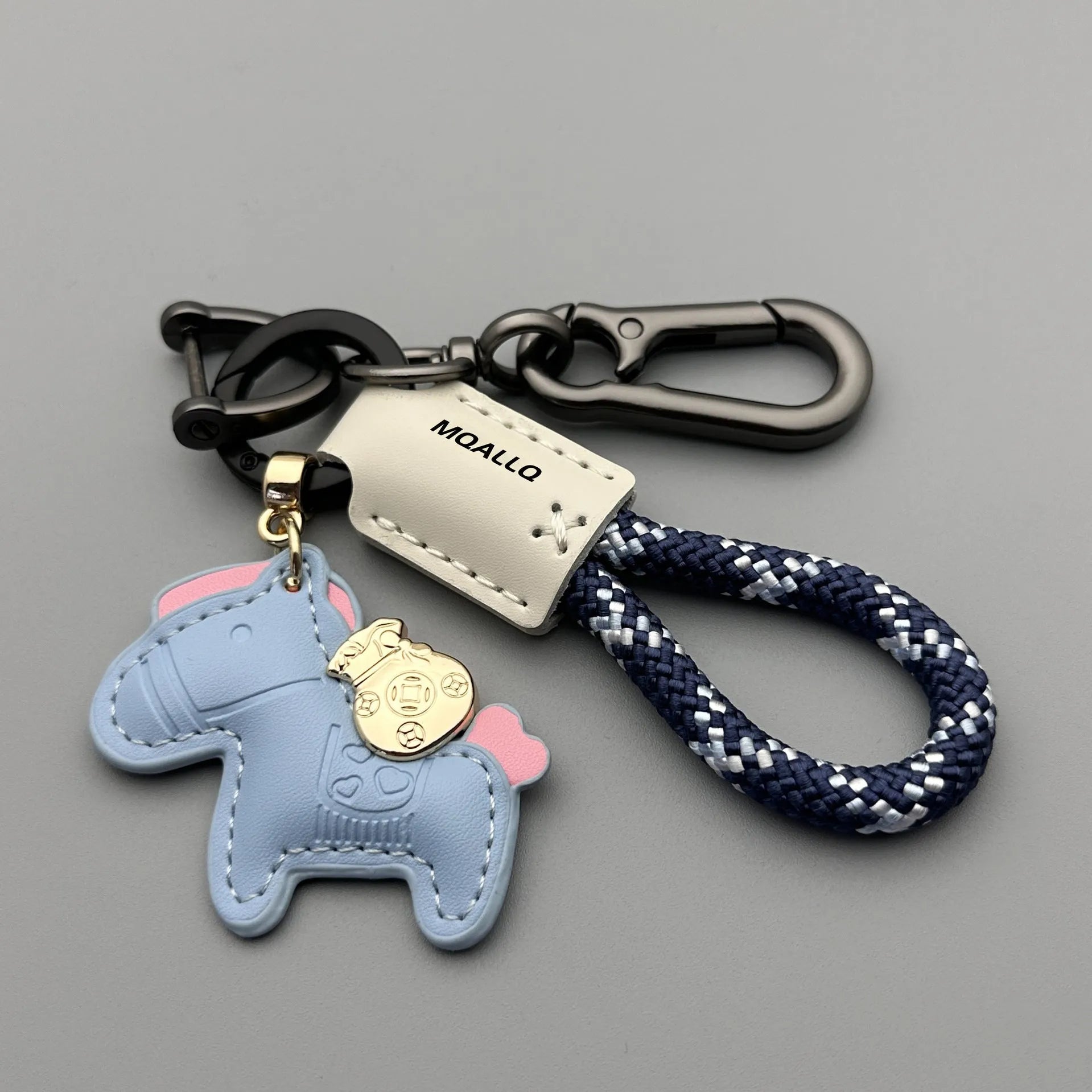 Handmade brown cowhide leather keychain with a silver pony belt buckle charm and green velvet rope.