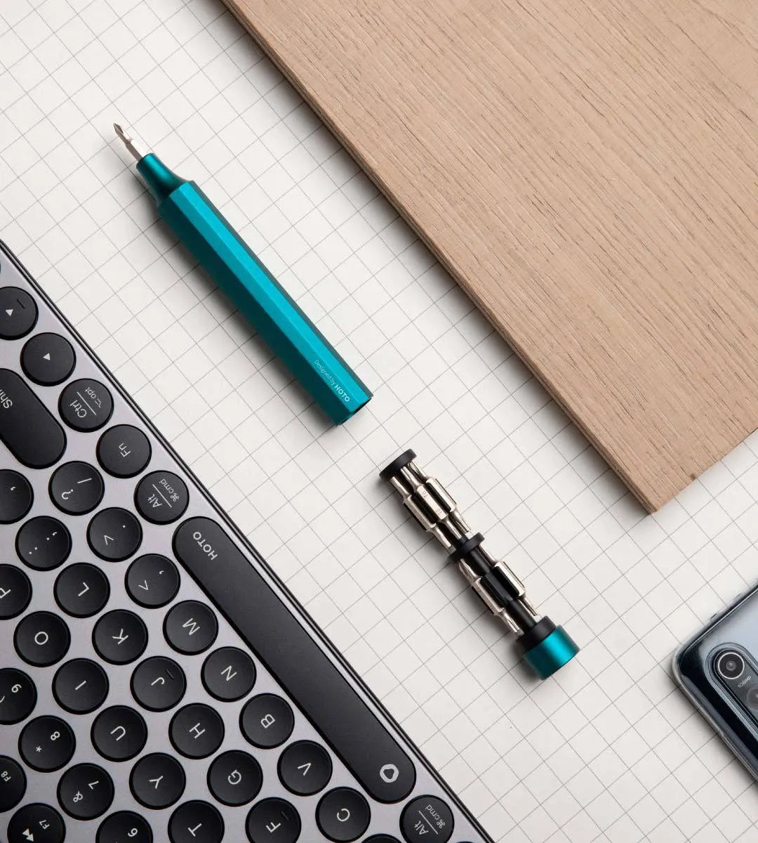 Green precision screwdriver set with 24 bits for mobile phone and computer repair disassembly.