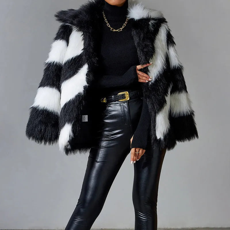 Minimalist faux fur coat with a contrasting colour lapel and a fur collar.