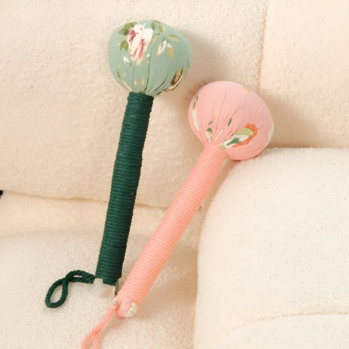 Argy wormwood handheld massage hammer in green colour on a plain background