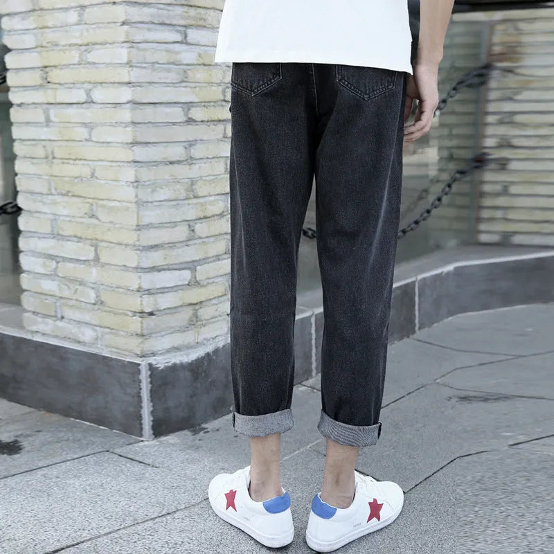 Men's loose fit straight leg jeans in black and blue colours showing harem style.