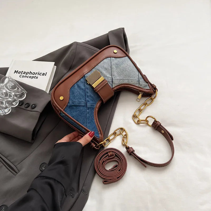 Brown soft denim women's shoulder bag with diamond mesh and chain details, showing bucket shape.