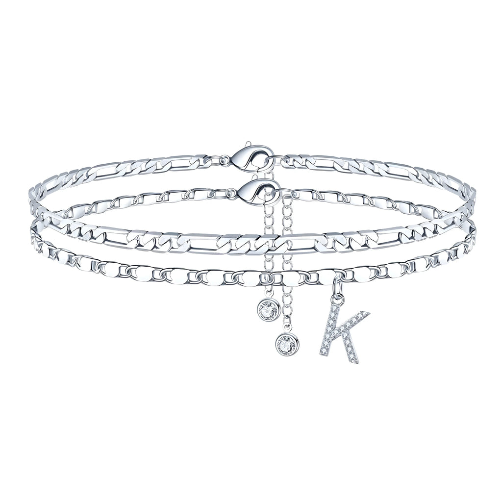 Silver-coloured copper anklet with double-circle beads and a personalised letter charm on an ankle.