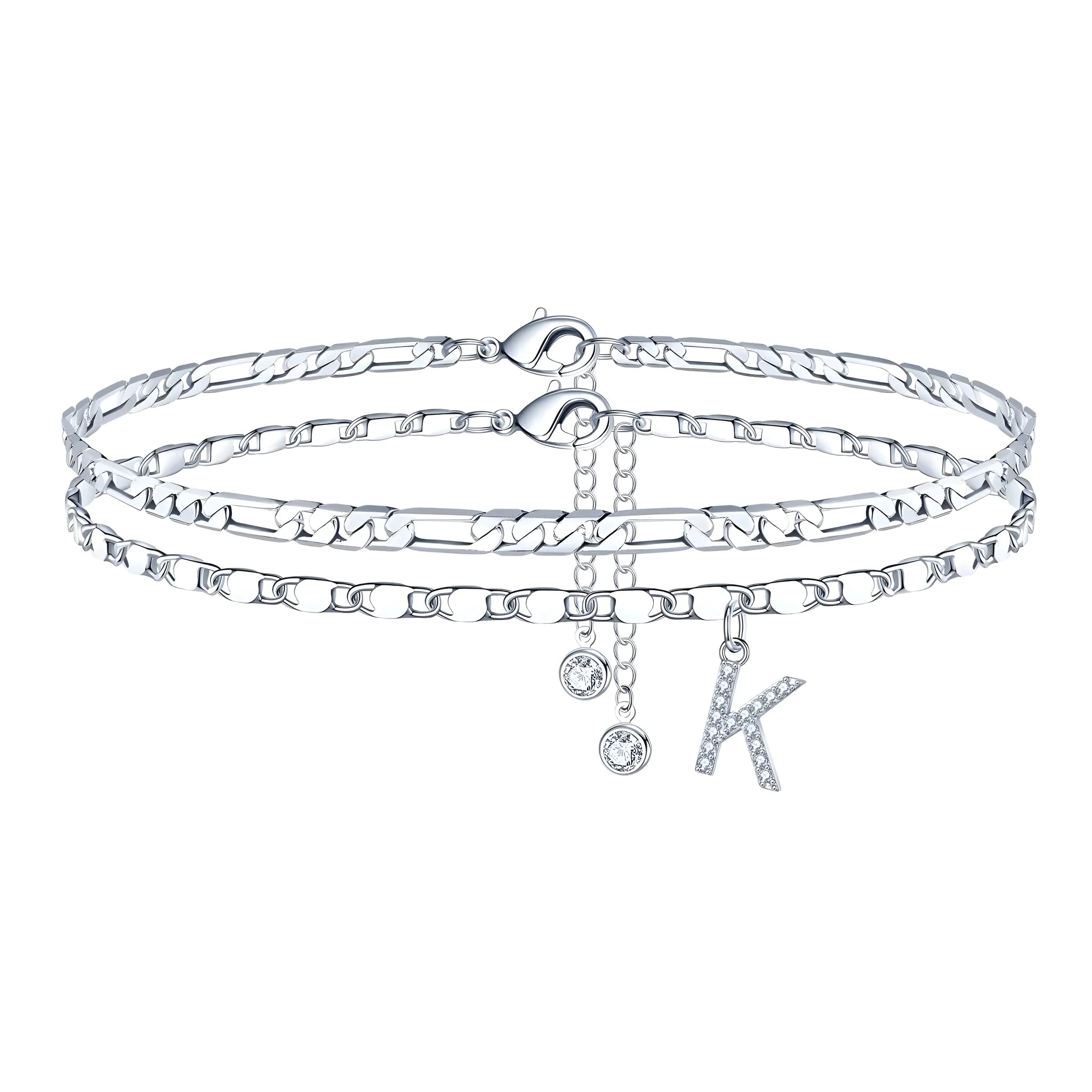Silver-coloured copper anklet with double-circle beads and a personalised letter charm on an ankle.