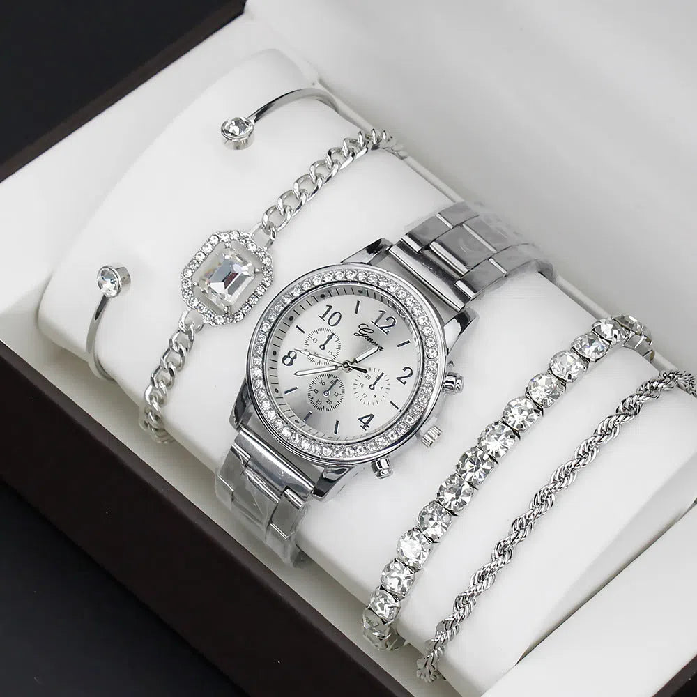 Women's 4 piece watch and bracelet set in gold colour with quartz movement and 34mm dial on display