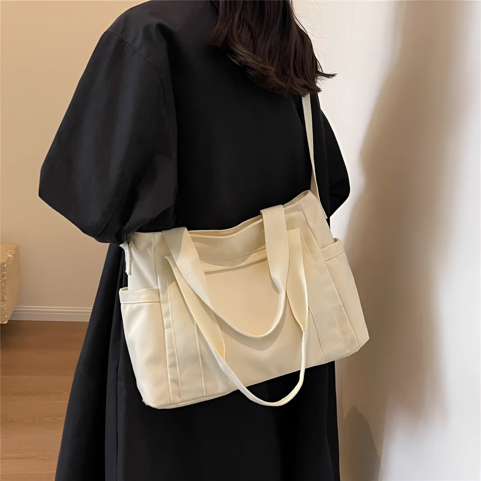 Large solid colour polyester canvas shoulder tote bag for women with outer pocket.