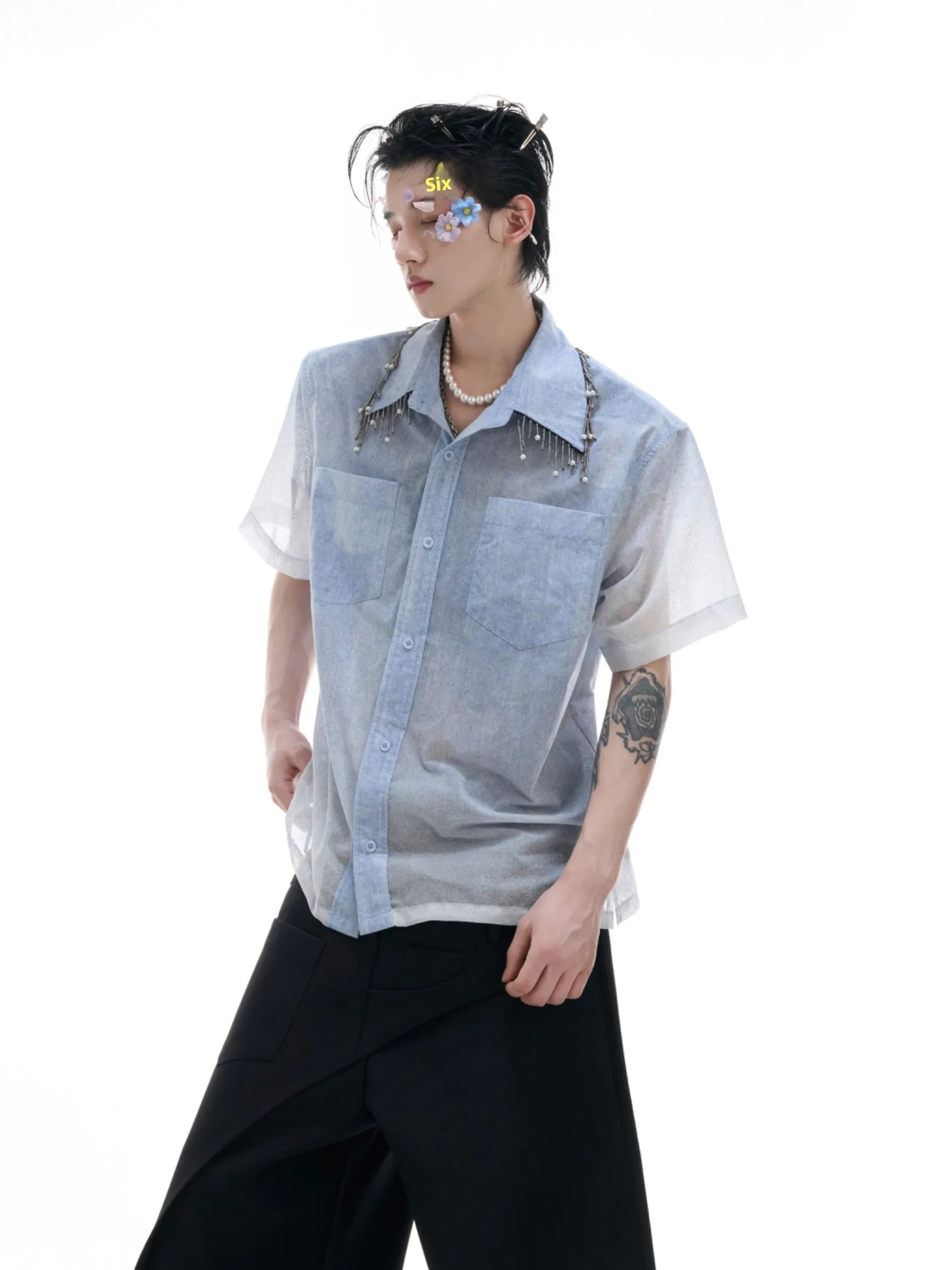 Blue loose fit short sleeve casual shirt on a hanger.